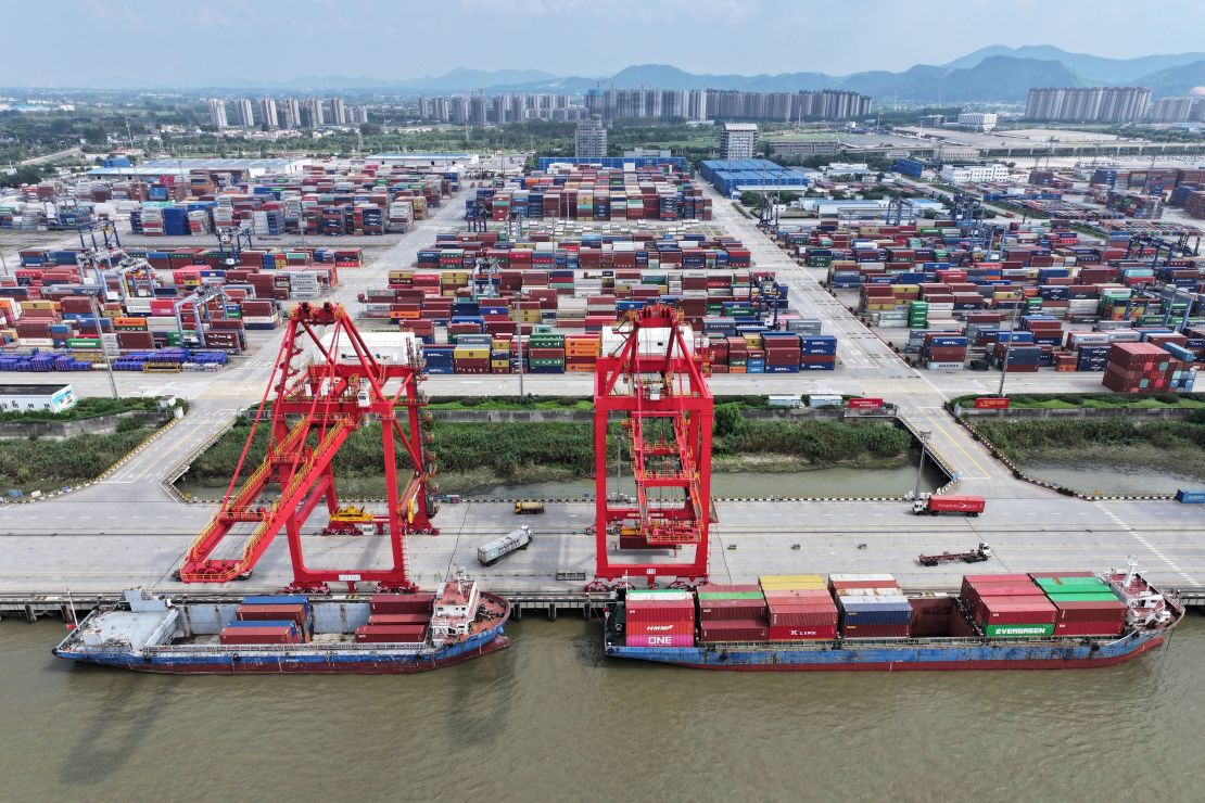 In this photo taken on August 6, 2023 a truck drives between containers at Nanjing port in Nanjing, in China's eastern Jiangsu Province. (Photo by STRINGER / AFP) / China OUT (Photo by STRINGER/AFP via Getty Images)