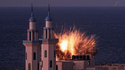 A fireball erupts from an Israeli airstrike in Gaza City on October 12, 2023. 