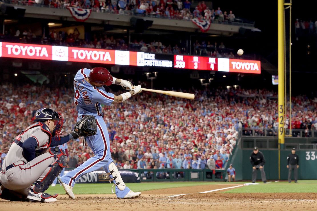 PHILADELPHIA, PENNSYLVANIA - OCTOBER 12: Nick Castellanos #8 of the Philadelphia Phillies hits a home run in the sixth inning against the Atlanta Braves during Game Four of the Division Series at Citizens Bank Park on October 12, 2023 in Philadelphia, Pennsylvania. (Photo by Tim Nwachukwu/Getty Images)