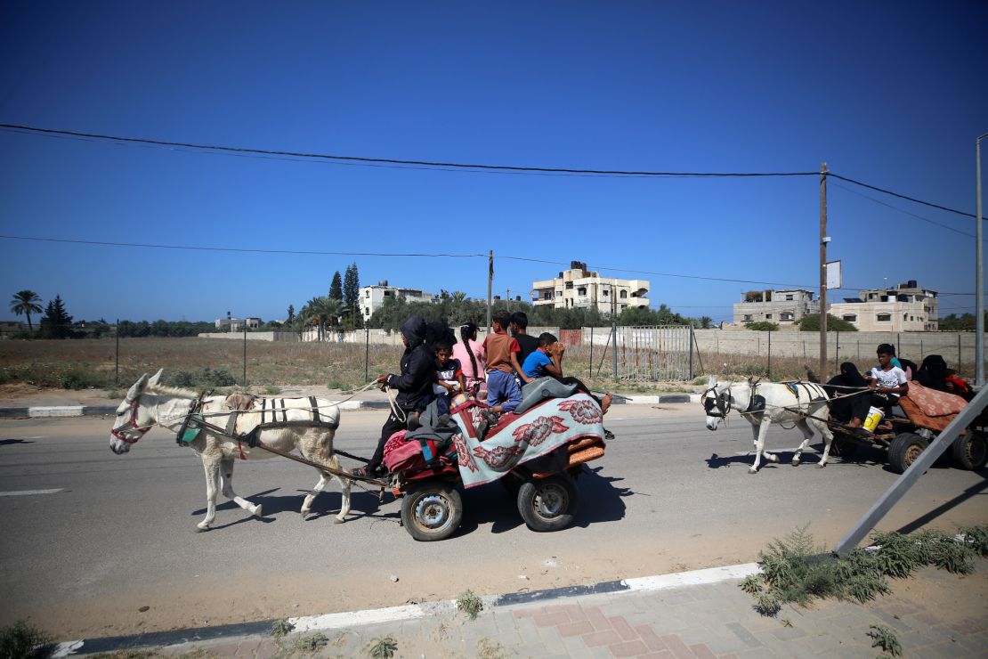 Palestinians flee in Gaza City, on Friday, after Israel called for the immediate relocation of 1.1 million people along the strip.