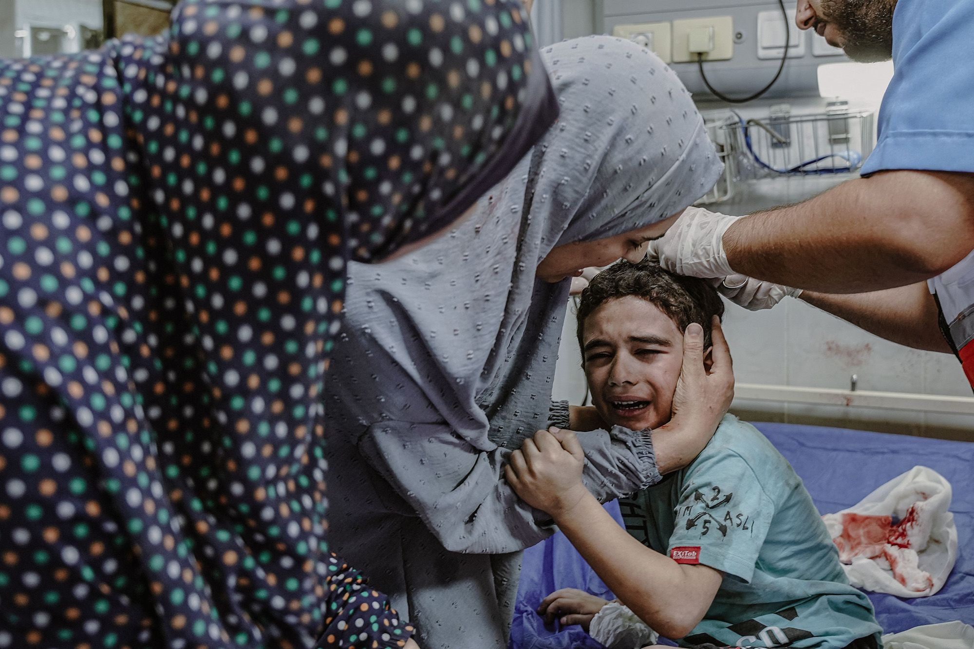 A Palestinian child is injured during bombing in Gaza on October 13.