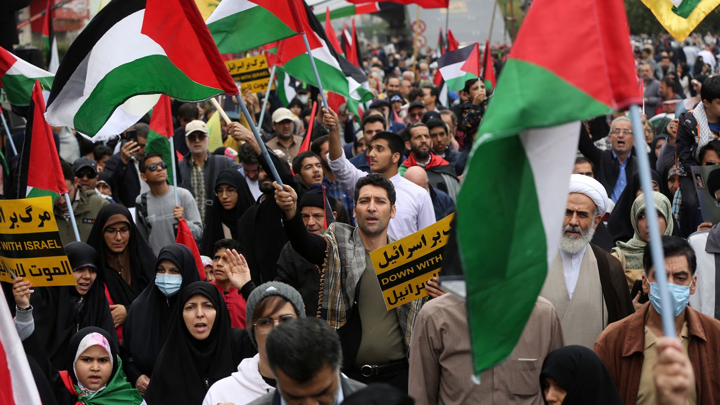 TEHRAN, IRAN - OCTOBER 13: People attend the Pro-Palestine demonstration as they hold banners and flags at the Revolution street in Tehran on October 13, 2023. (Photo by Fatemeh Bahrami/Anadolu via Getty Images)