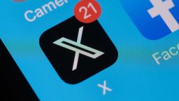 This photo illustration shows the X logo (formerly Twitter) on a smartphone screen in Los Angeles, California, on July 31, 2023. San Francisco sent the company formerly known as Twitter a warning on July 31, 2023, that it needed proper permits for the giant, flashing new X sign atop its headquarters, after the tech firm twice refused to let building inspectors check it. (Photo by Chris Delmas / AFP) (Photo by CHRIS DELMAS/AFP via Getty Images)