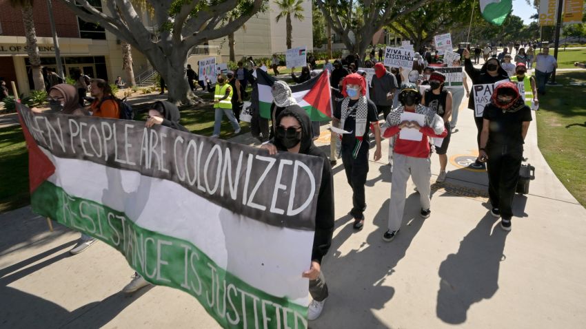 Long Beach, CA - October 10: Long Beach, CA - October 10:  LA F.U.E.R.Z.A, a student-run advocacy group, marched through the campus of CSU Long Beach for a Day of Resistance protest for Palestine in Long Beach on Tuesday, October 10, 2023. The majority of participants wore face coverings and refused to speak with media but they did periodically stop and give speeches. (Photo by Brittany Murray/MediaNews Group/Long Beach Press-Telegram via Getty Images)