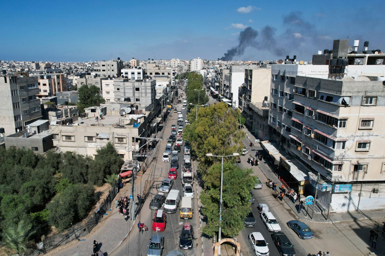 Palestinians flee from northern Gaza to the south after the Israeli army issued an evacuation warning to seek refuge in the south, on October 13.