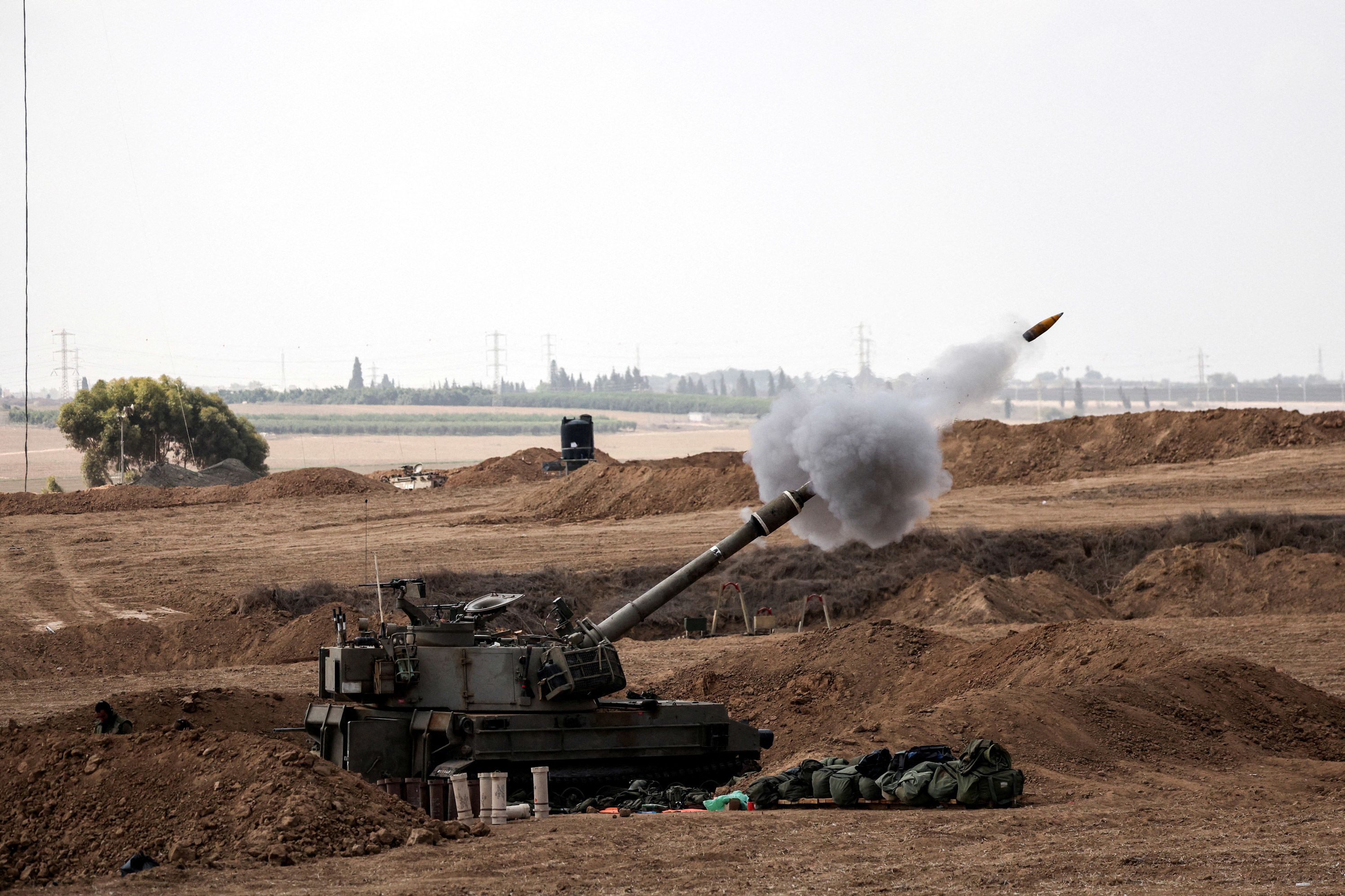 Israeli artillery fires on the Israel-Gaza border on October 13.