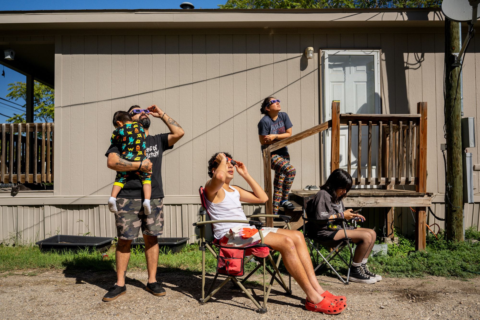 The Flores family watches the eclipse in Kerrville, Texas.