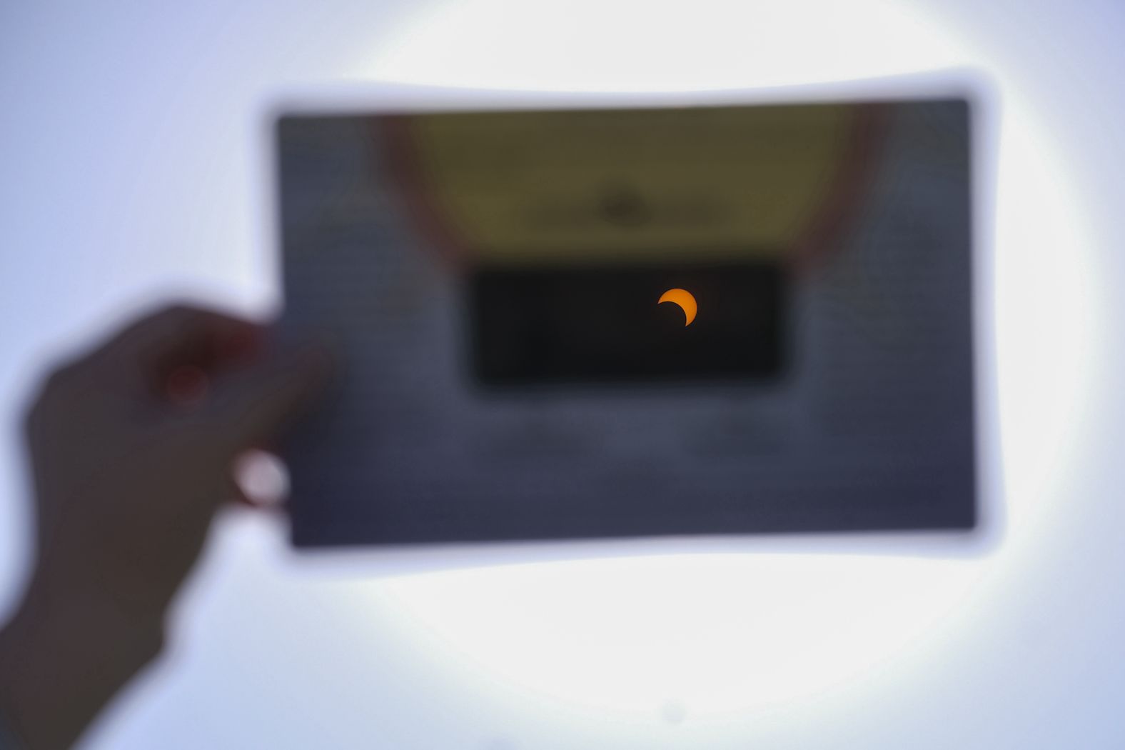 The eclipse is seen through a special protective glass at the Griffith Observatory in Los Angeles.