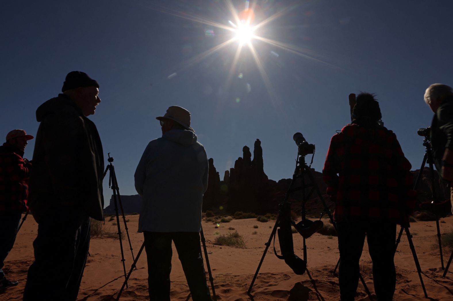 People gather to watch the eclipse at Monument Valley in the Navajo Nation, Arizona.
