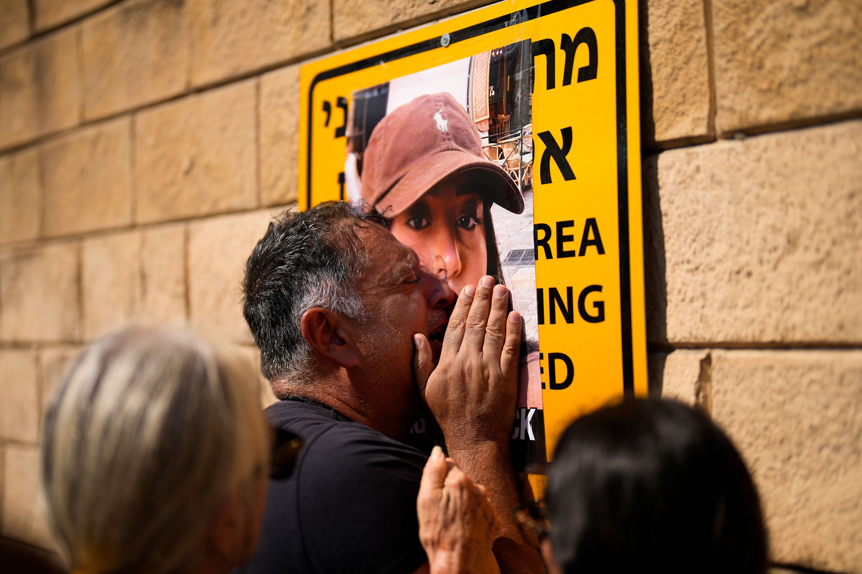 Eli Albag cries over the photograph of his daughter Liri, as he gathers with others during a protest demanding the release of more than 100 Israelis who were abducted during last week's Hamas attack, in Tel Aviv, Israel, on October 14.