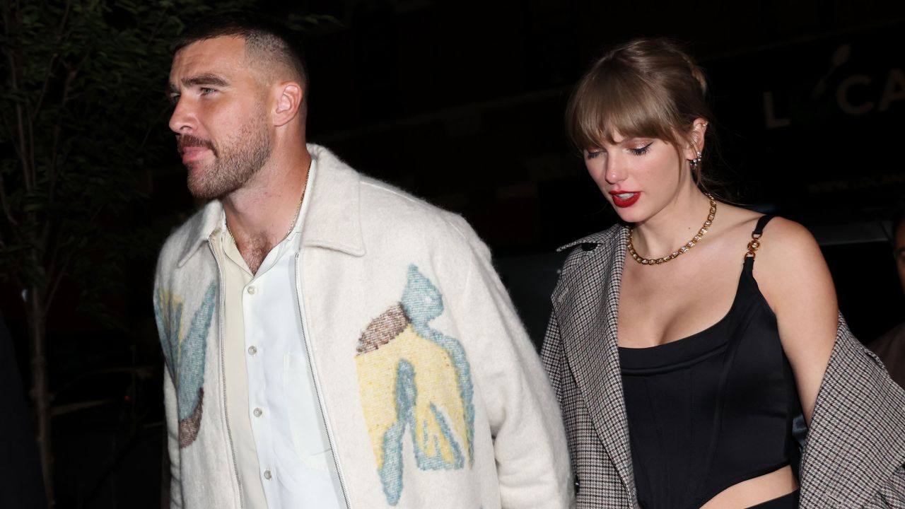 Travis Kelce and Taylor Swift hold hands in New York City on October 14.