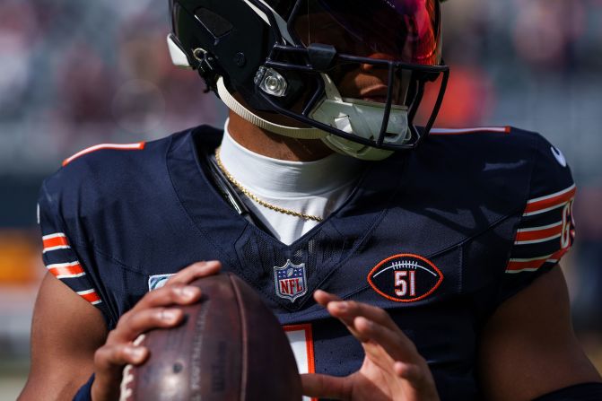 Chicago Bears quarterback Justin Fields warms up wearing a #51 patch honoring the late <a href="https://www.cnn.com/2023/10/05/sport/dick-butkus-death-illinois-bears/index.html" target="_blank">Dick Butkus</a> before the Bears' game against the Minnesota Vikings at Soldier Field in Chicago on October 15. Butkus, a hard-hitting Pro Football Hall of Fame linebacker who played nine seasons for the Bears, died October 5. 