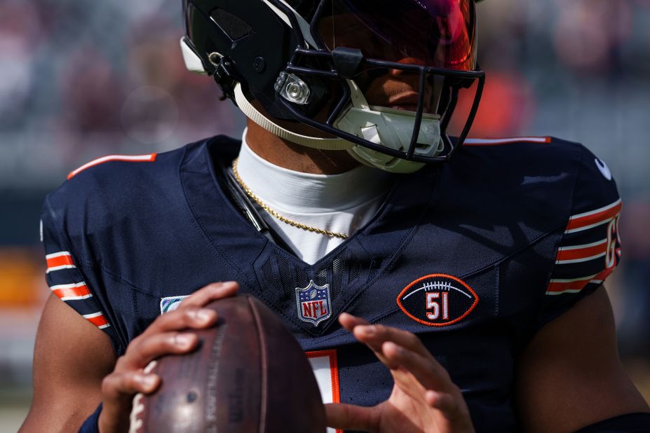 Chicago Bears quarterback Justin Fields warms up wearing a #51 patch honoring the late <a href="https://www.cnn.com/2023/10/05/sport/dick-butkus-death-illinois-bears/index.html" target="_blank">Dick Butkus</a> before the Bears' game against the Minnesota Vikings at Soldier Field in Chicago. Butkus, a hard-hitting Pro Football Hall of Fame linebacker who played nine seasons for the Bears, died October 5. 