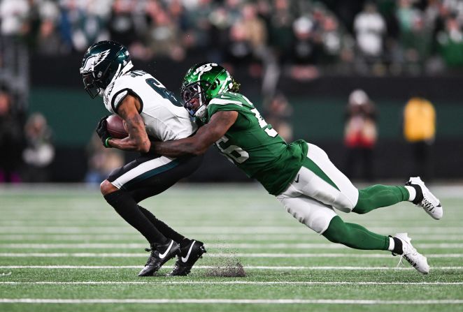 Quincy Williams of the New York Jets tackles Philadelphia Eagles wide receiver DeVonta Smith on October 15. The Eagles are 5-1 for the season after their 20-14 loss to the Jets.