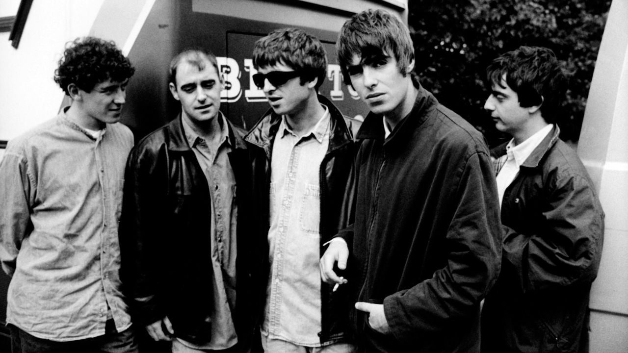 In this January 1994 photo, Noel and Liam Gallagher, center pose with other Oasis band members Tony McCarroll, Paul Arthurs and Paul McGuigan in the Netherlands. 