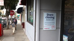Pedestrians walk by a Walgreens store that was set to close in October of 2021 in San Francisco, California. Walgreens had already shuttered numerous stores in the city since 2019. 