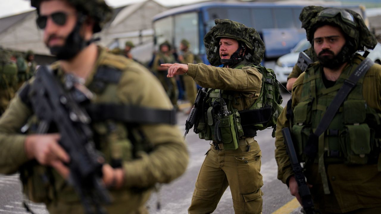 Israeli soldiers patrol a road near the border with Lebanon, on Monday, amid threat of a regional conflict between Israel and Iran-backed Hezbollah. 