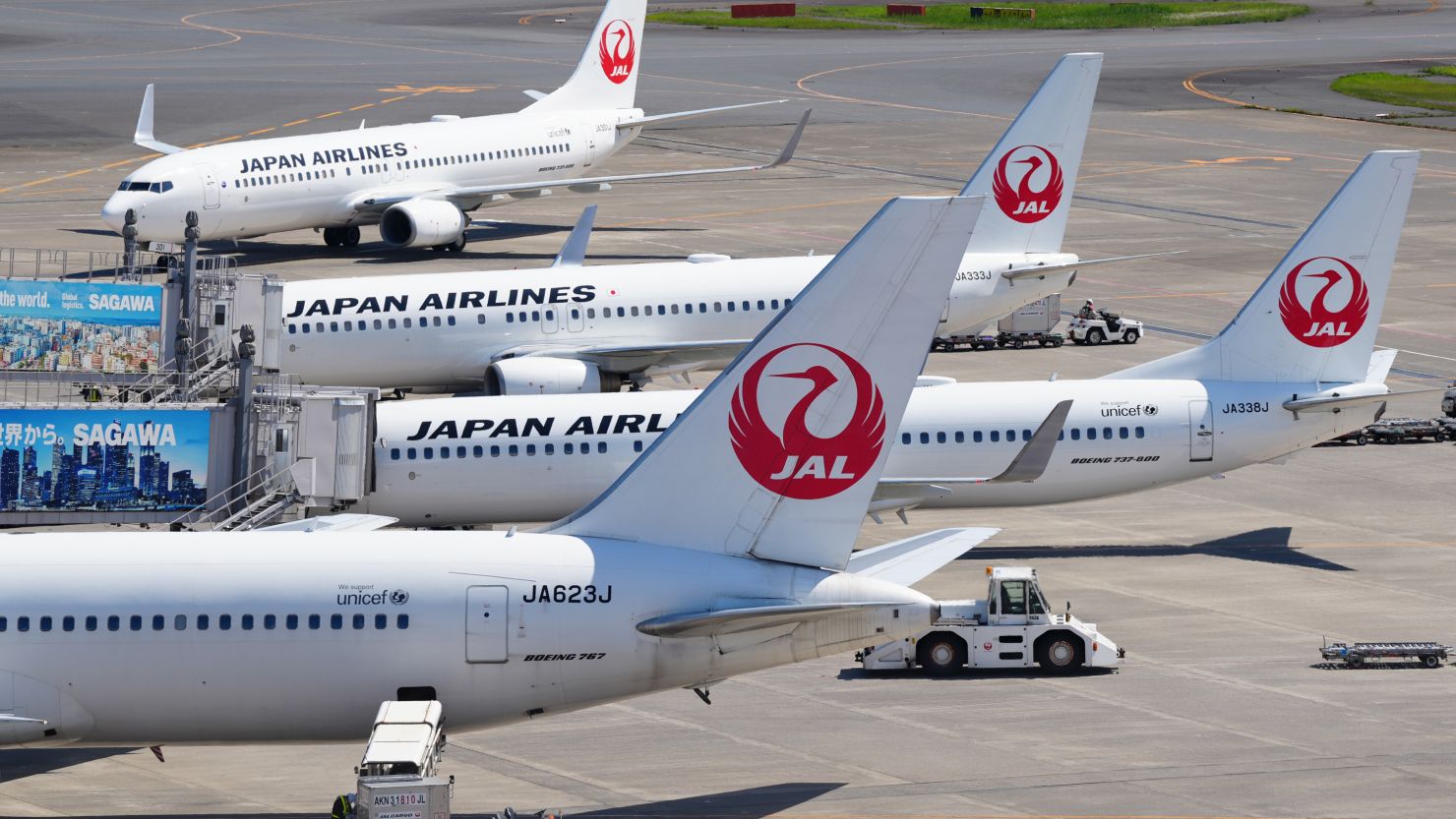 Japan Airlines planes sit on the tarmac at Haneda Airport in Tokyo, Japan. 