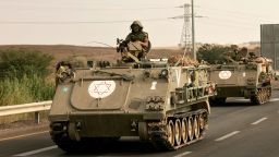 Israeli soliders ride in their armoured vehicles towards the border with the Gaza Strip on October 16, 2023, amid the ongoing battles between Israel and the Palestinian group Hamas. 