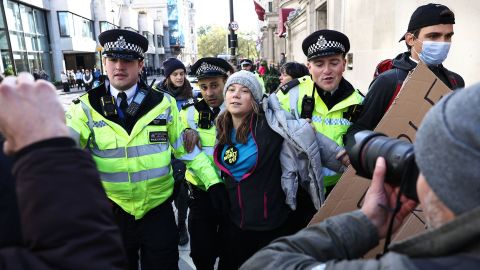 Swedish climate activist Greta Thunberg is arrested by police outside the InterContinental London Park Lane during the "Oily Money Out" demonstration organised by Fossil Free London and Greenpeace on the sidelines of the opening day of the Energy Intelligence Forum 2023 in London on October 17, 2023. (Photo by HENRY NICHOLLS / AFP) (Photo by HENRY NICHOLLS/AFP via Getty Images)