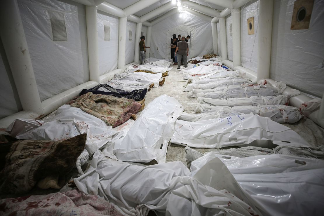 Bodies of those killed in a blast at Al-Ahli Hospital are laid out in the front yard of the Al-Shifa Hospital in Gaza City on Tuesday, October 17.