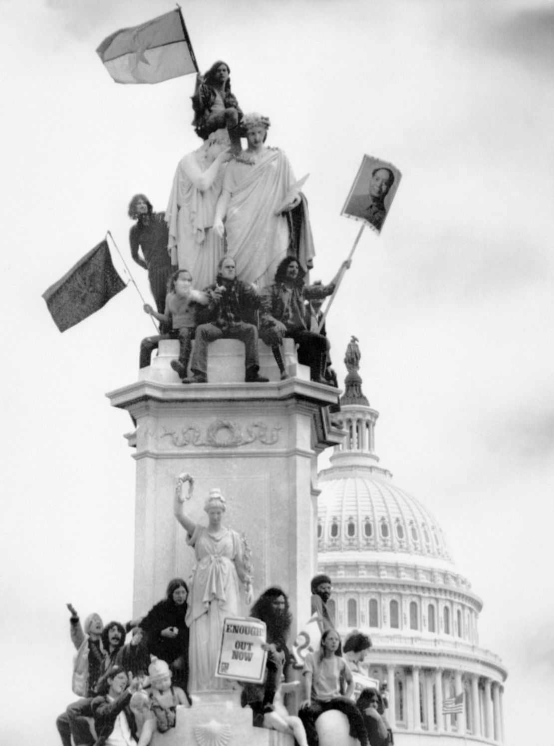 WASHINGTON, :  American youths waving Vietcong flag and portrait of Chinese leader Mao Zedong stage a rally 25 April 1971 in front of the Capitol in Washington, D.C. protesting United States military involvement in the Vietnam war. (Photo credit should read AFP/AFP via Getty Images)