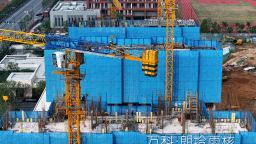This aerial photo taken on October 9, 2023 shows residential buildings under construction by Chinese real estate developer Vanke in Nanjing, in China's eastern Jiangsu province. 