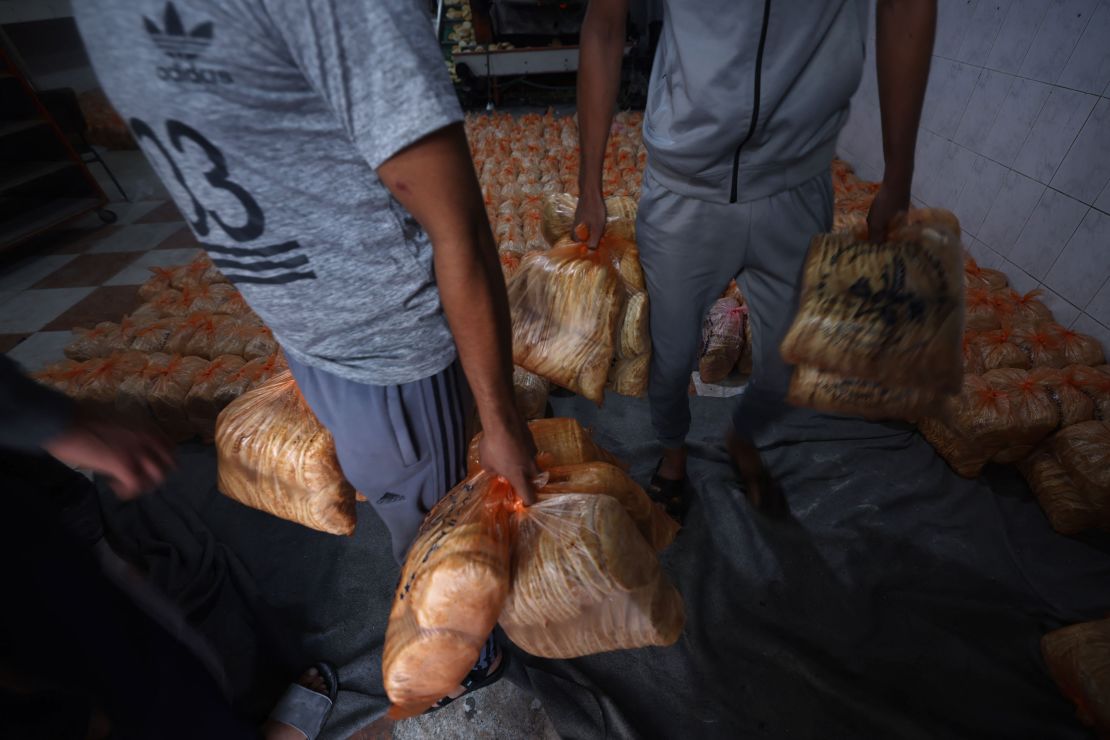 A bakery prepares rations of bread to pass out to internally displaced Palestinians in the southern Gaza Strip on October 17, 2023. 