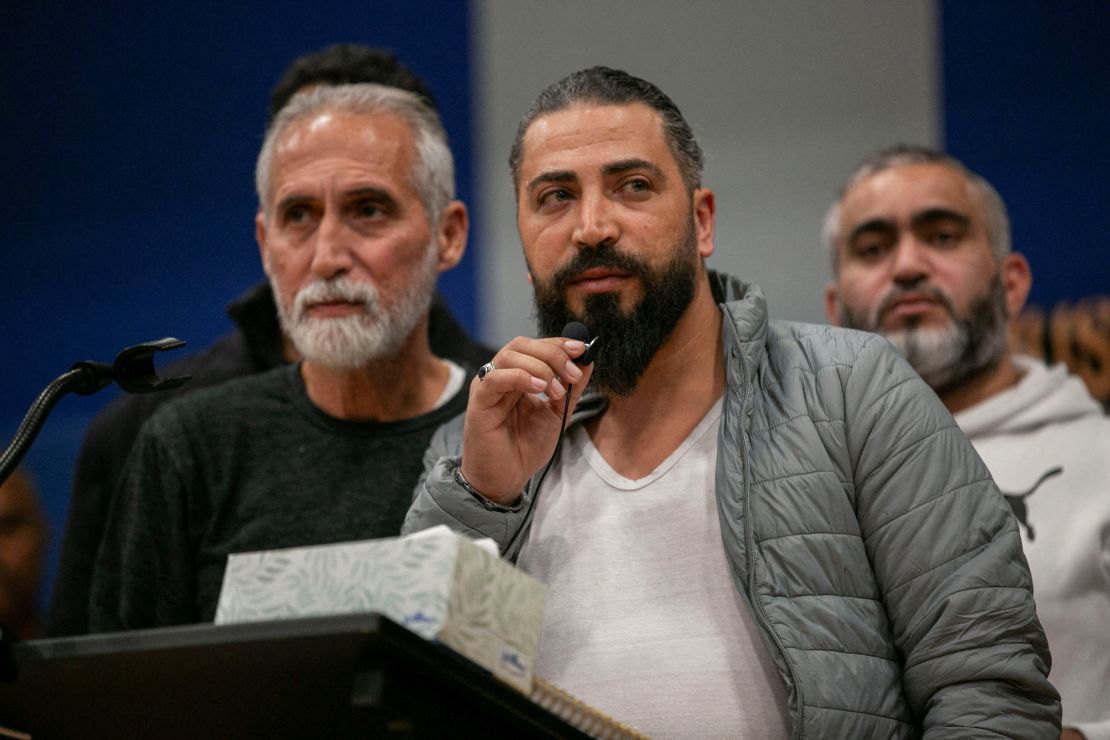 Wadea Al-Fayoume's father speaks at a vigil service at the Prairie Activity & Recreation Center in Plainfield, Illinois, on Tuesday.