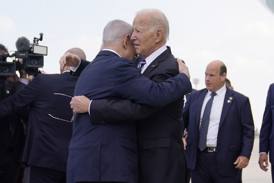 President Joe Biden is greeted by Israeli Prime Minister Benjamin Netanyahu after arriving at Ben Gurion International Airport, in Tel Aviv, on October 18. 
