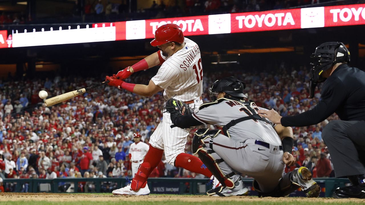 PHILADELPHIA, PENNSYLVANIA - OCTOBER 17: Kyle Schwarber #12 of the Philadelphia Phillies hits a home run in front of Gabriel Moreno #14 of the Arizona Diamondbacks during Game Two of the Championship Series at Citizens Bank Park on October 17, 2023 in Philadelphia, Pennsylvania. (Photo by Sarah Stier/Getty Images)