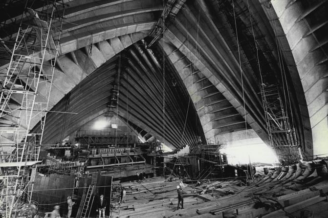 <strong>Taking shape: </strong>This 1969 photo shows how small workers appear inside the huge structure they're building.