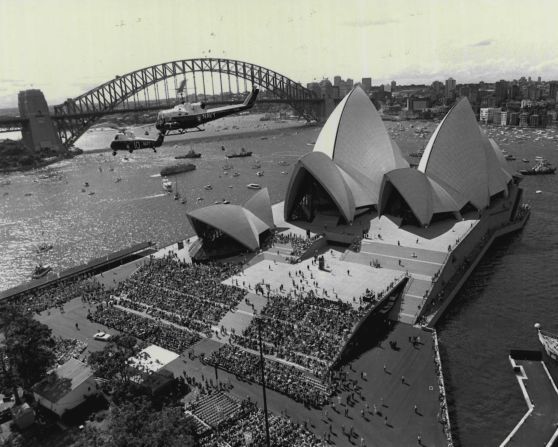 <strong>The big reveal:</strong> Crowds gather to watch the official opening of the Sydney Opera House on October 20, 1973.