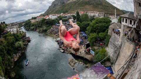 In this handout image provided by Red Bull, Molly Carlson of Canada dives from the 21 metre platform on Stari Most (Old Bridge) during the final competition day of the third stop of the Red Bull Cliff Diving World Series on August 28, 2021 at Mostar, Bosnia and Herzegovina.