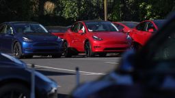 Brand new Tesla cars sit parked at a Tesla dealership on October 18, 2023 in Corte Madera, California. Electric car maker Tesla will report third-quarter earnings today after the closing bell. 