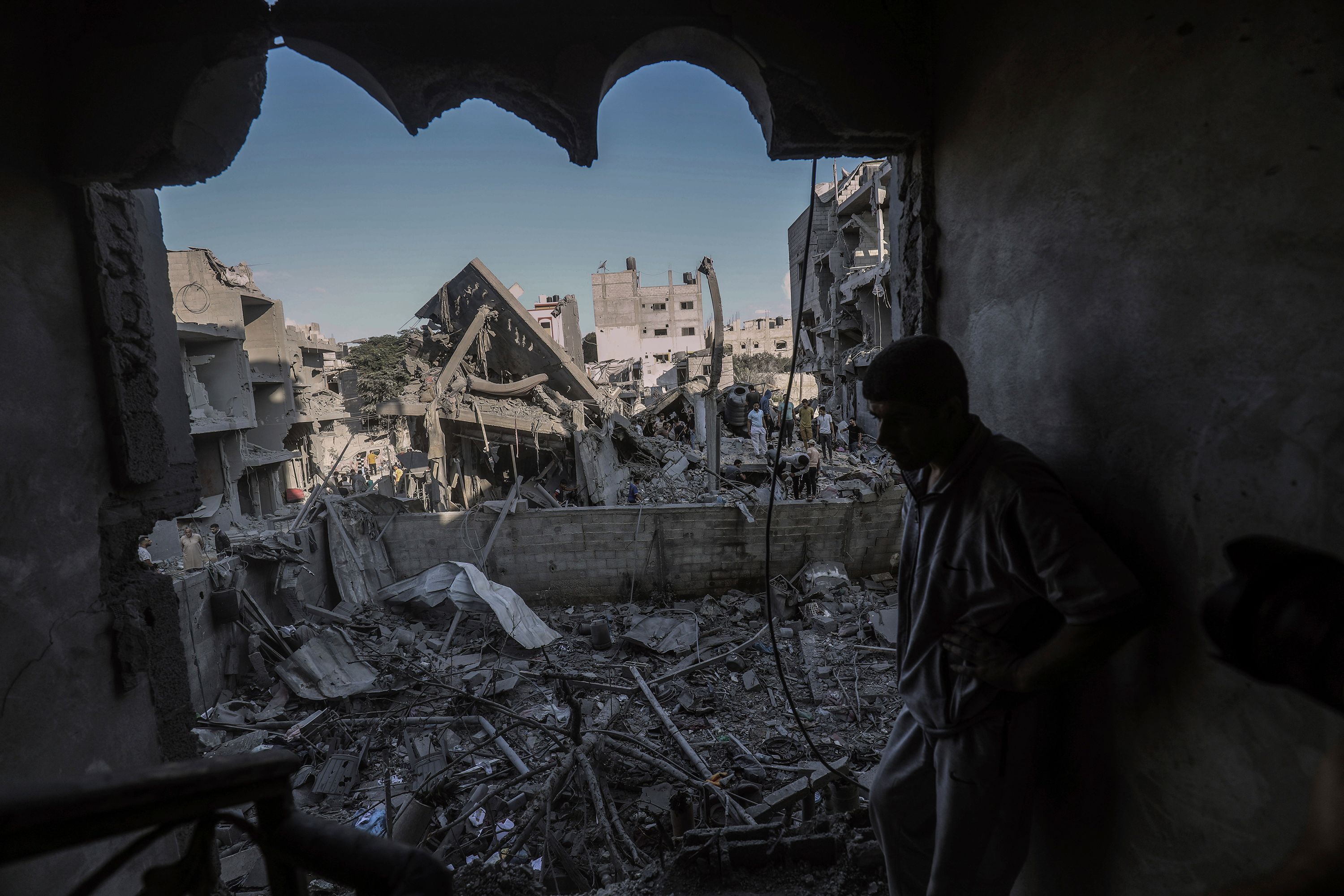 A Palestinian man inspects a destroyed house belonging to the Al-Jazzar family after an airstrike in Rafah, Gaza, on October 18.