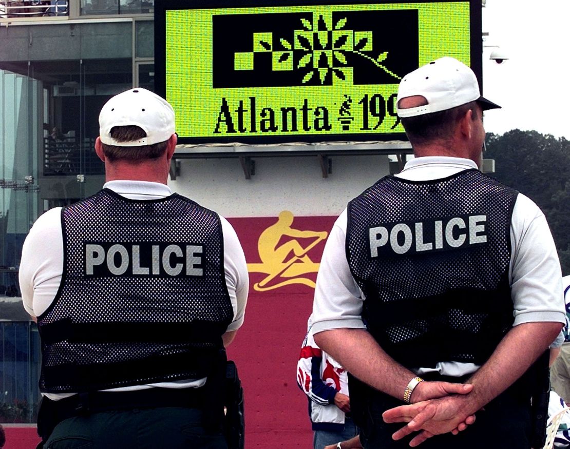 Olympic police officers stand guard at the rowing and canoe/kayak competitions venue of Lake Lanier near Gainesville, Georgia July 15 prior to the 1996 Summer Olympics Games which open on July 19 in Atlanta.
**DIGITAL IMAGE**