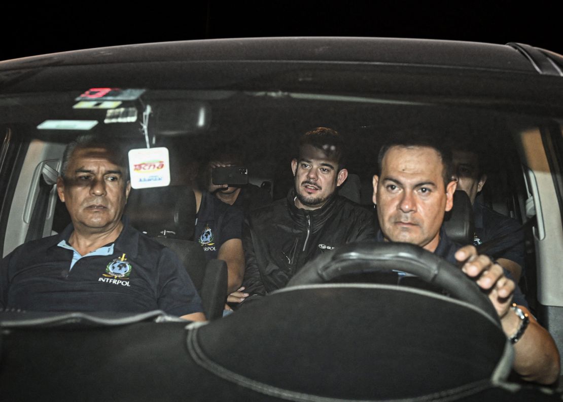 Joran van der Sloot (center) is transferred in a police car from the Ancon I jail in Lima, Peru, on June 8.