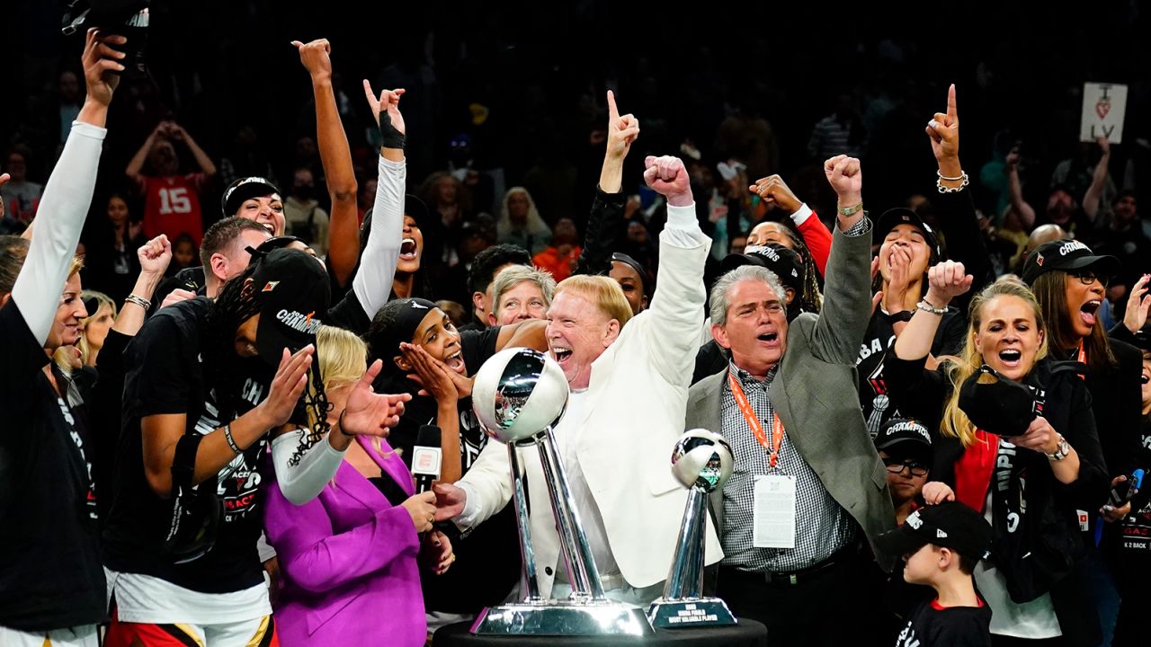 The Las Vegas Aces celebrate with the trophy after winning Game 4 of a WNBA basketball final playoff series against the New York Liberty on Wednesday in New York. 