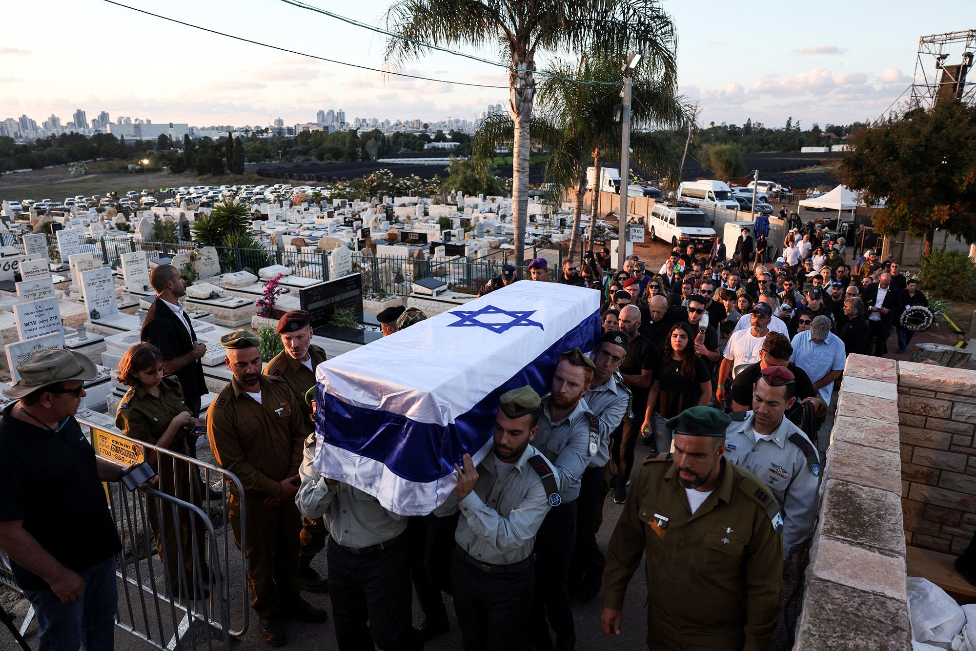Friends and relatives of Ofir Libstein, who served as head of the Sha'ar HaNegev Regional Council and died during the Kibbutz Kfar Aza attack, mourn at his funeral in Even Yehuda, Israel, on Wednesday, October 18.