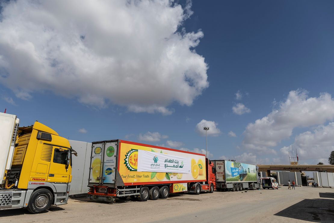 Aid convoy trucks wait at the Rafah Crossing for clearance to enter Gaza on October 19, 2023 in North Sinai, Egypt. 