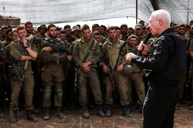 Israel's Defense Minister Yoav Gallant meets soldiers in a field near Israel's border with Gaza on October 19. <a href="index.php?page=&url=https%3A%2F%2Fwww.cnn.com%2F2023%2F10%2F19%2Fmiddleeast%2Fisrael-gaza-hamas-war-thursday-intl-hnk%2Findex.html" target="_blank">Gallant told the soldiers</a>, "You see Gaza now from a distance, you will soon see it from inside."