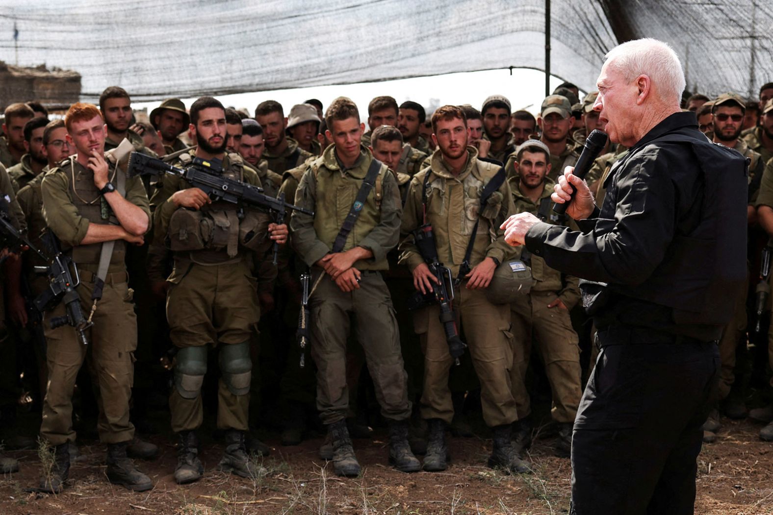 Israel's Defense Minister Yoav Gallant meets soldiers in a field near Israel's border with Gaza on October 19. <a  target="_blank">Gallant told the soldiers</a>, "You see Gaza now from a distance, you will soon see it from inside."