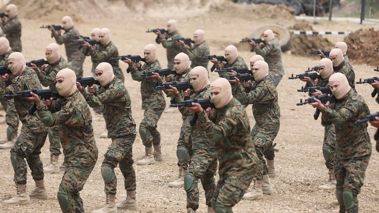Hezbollah members take part in a military exercise during a media tour in Aaramta, Lebanon on May 21, 2023. 
