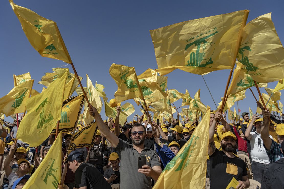 People with Hezbollah flags at a rally in Baalbek in Lebanon's Bekaa Valley in May 2022.