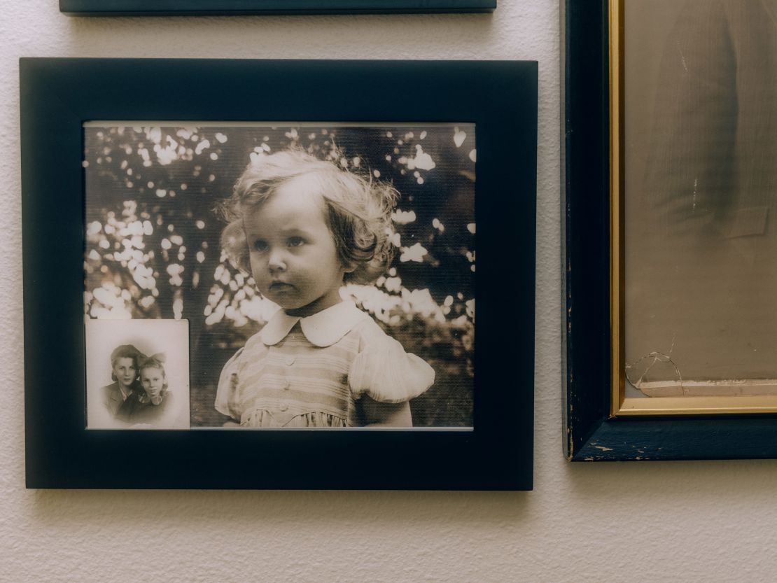 Old family photos are seen at Charlotte Hauptman's home. She escaped the Holocaust as a child.