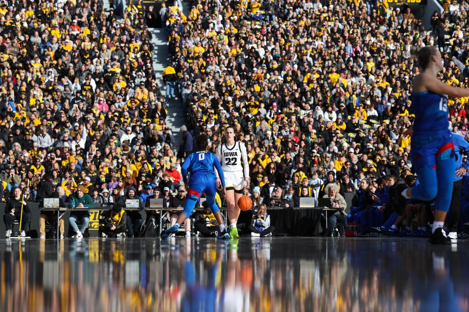 Iowa Hawkeyes guard Caitlin Clark dribbles the ball during an exhibition game against DePaul at Kinnick Stadium in Iowa City, Iowa, on Sunday, October 15. The match—the first women's basketball game to be played outdoors in a football stadium—set an NCAA <a href=