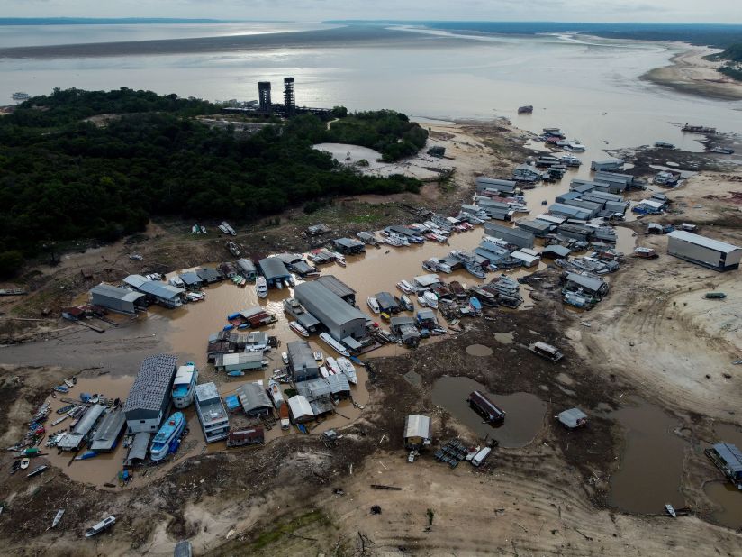 An aerial view of boats and floating homes that have become stranded due to low water levels on the Rio Negro in Manaus, Brazil, on Monday, October 16.