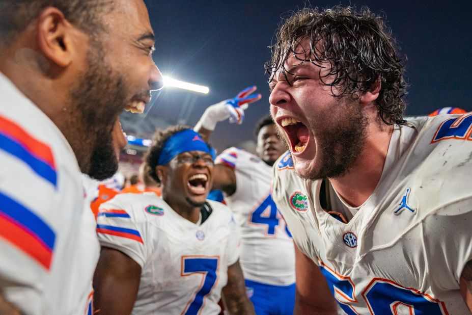 Florida teammates Austin Barber, right, and Derek Wingo celebrate after defeating South Carolina in a college football game in Columbia, South Carolina, on Saturday, October 14.