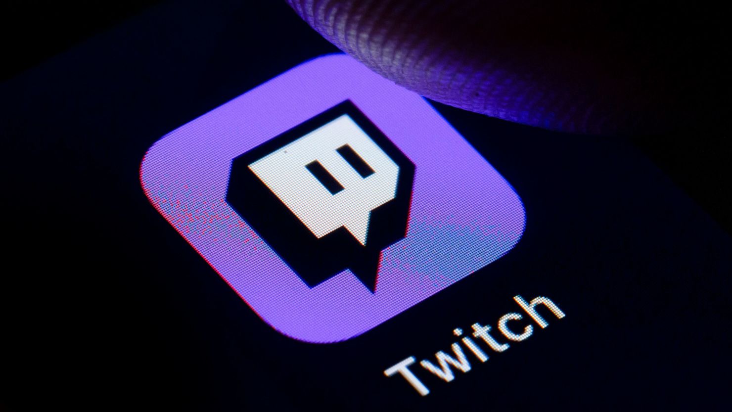 BERLIN, GERMANY - OCTOBER 11: In this photo illustration the logo of live streaming video platform Twitch is displayed on a smartphone on October 11, 2019 in Berlin, Germany. (Photo Illustration by Thomas Trutschel/Photothek via Getty Images)